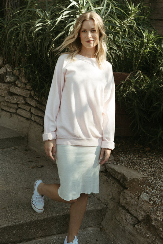 Organic cotton fleece sweatshirt with vintage 1950s raglan cut, ribbed trim, and hand-dyed finish in sun-washed tones. Made in California.