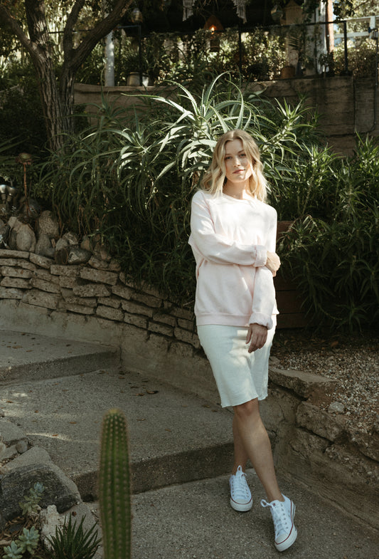 Organic cotton fleece sweatshirt with vintage 1950s raglan cut, ribbed trim, and hand-dyed finish in sun-washed tones. Made in California.