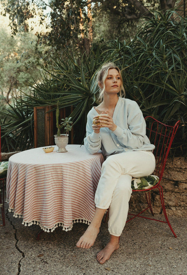 Women's organic cotton thermal sweatpants with vintage pink contrast stitching, cropped 70s-inspired fit.